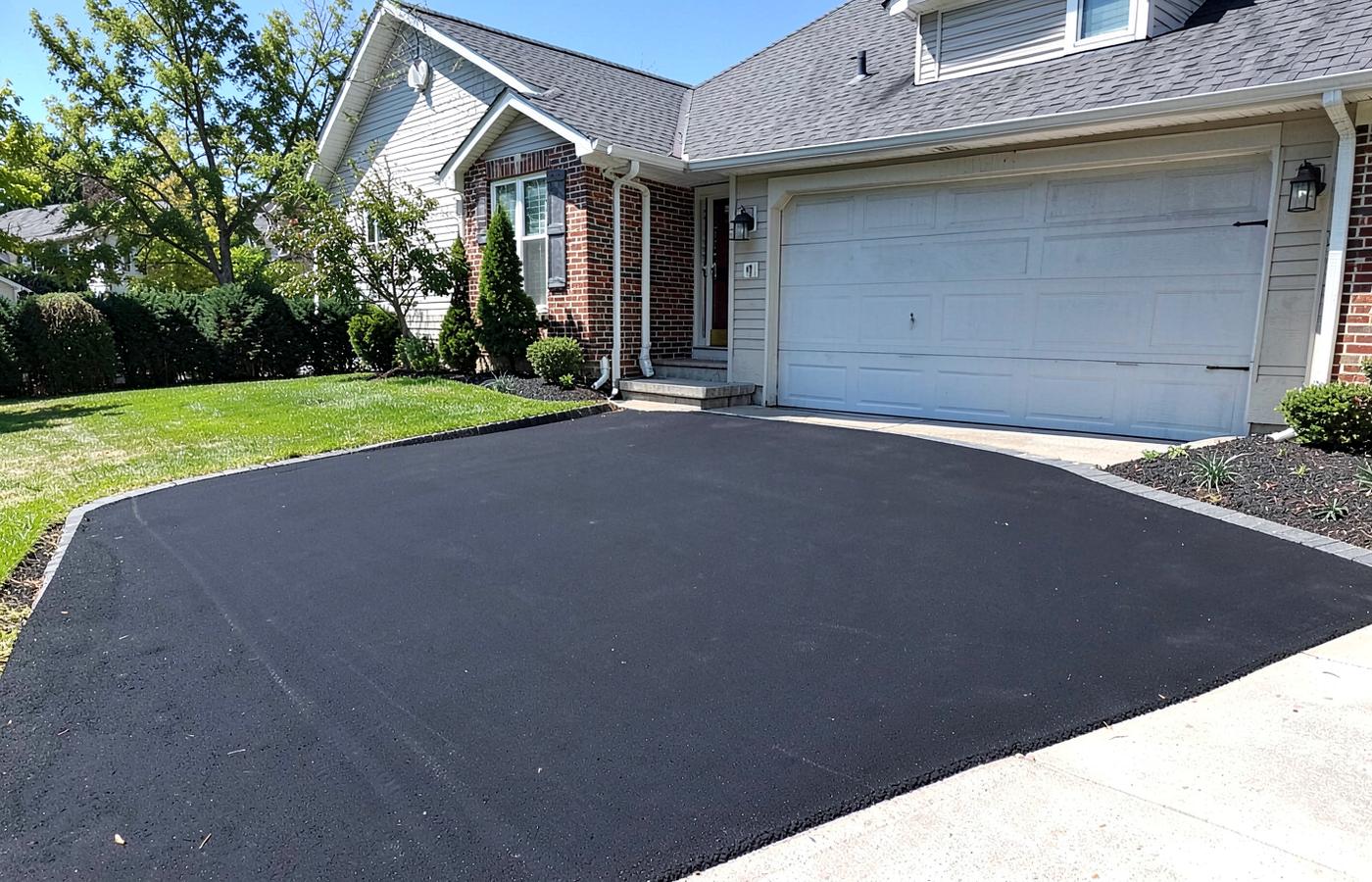 Cracked Driveway to Fresh Asphalt — after